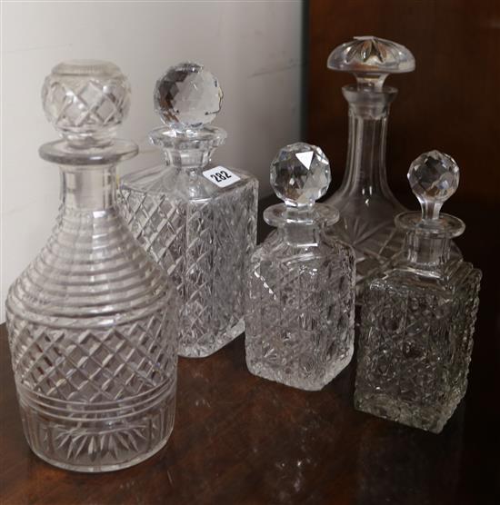 Five cut glass decanters and a commemorative goblet
